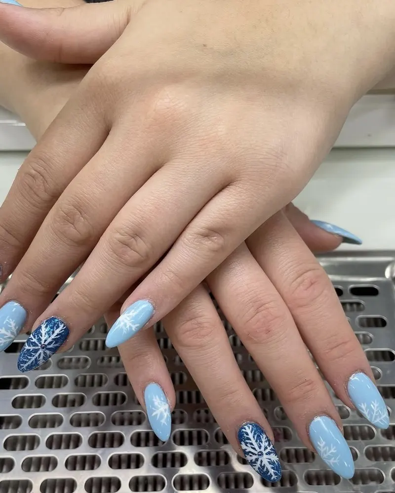 Icy blue nails with snowflake art