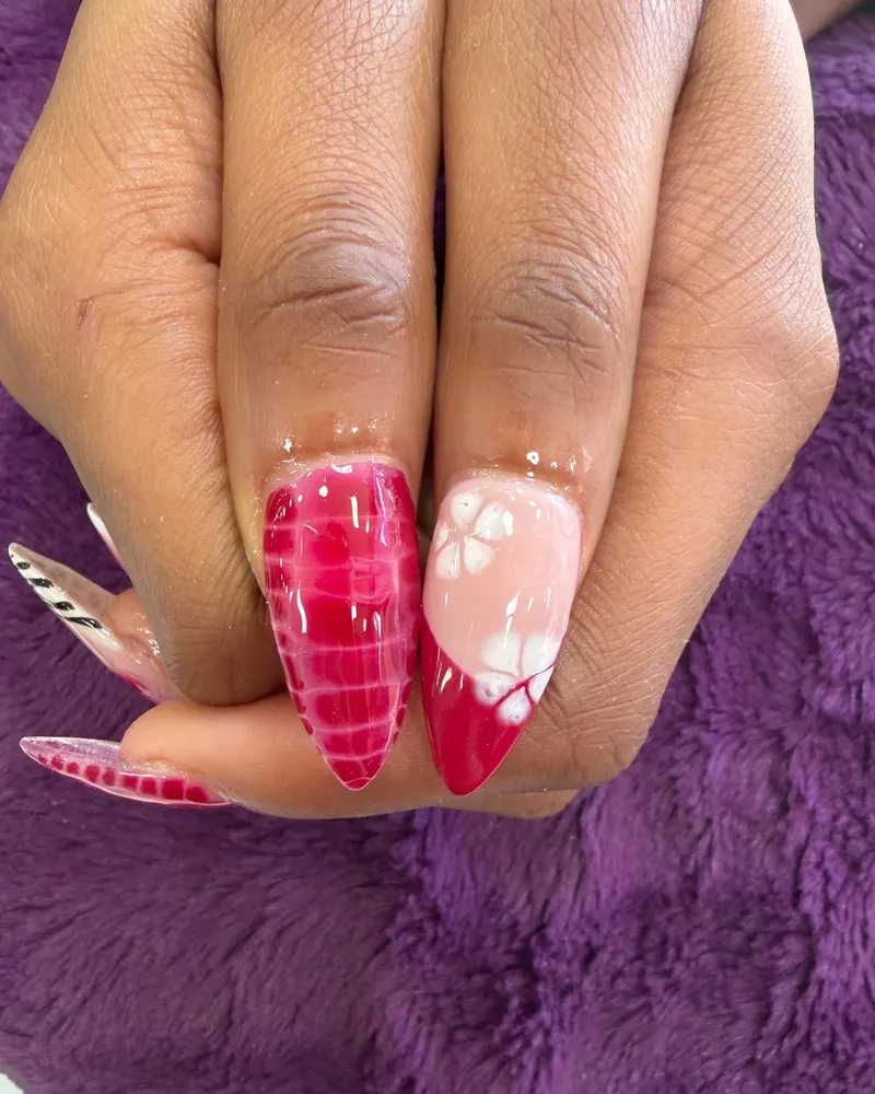 Red croc-effect nails with hand-painted white flowers
