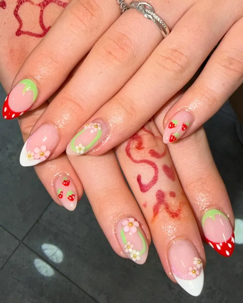 Red French tips with hand-painted strawberries and flowers