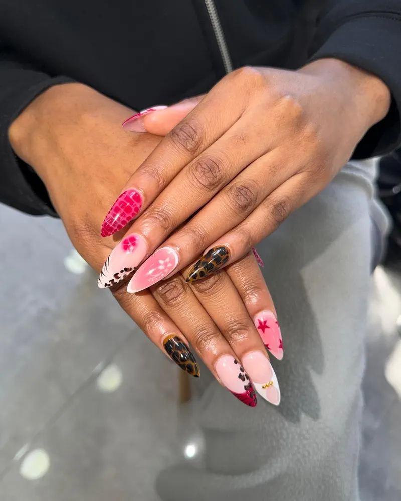 Mixed pink and brown nail art with flowers and checks